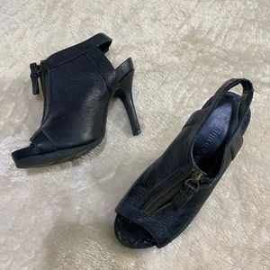 Black leather peep toe booties with front zipper
